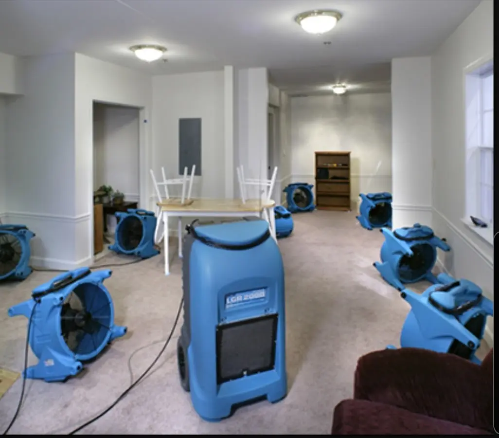 Air movers and dehumidifier setup for Water Damage Restoration in Whitman